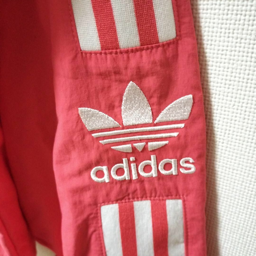 Originals（adidas）(オリジナルス)のアディダス 薄赤 ロックアップ トラックジャケット ジャージ 刺繍 メンズ M メンズのジャケット/アウター(ナイロンジャケット)の商品写真