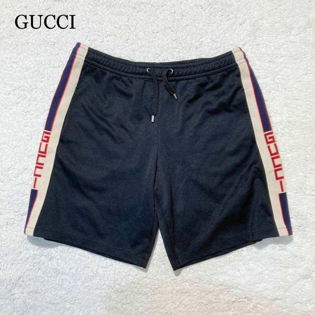 Gucci(グッチ)の【極美品】GUCCI グッチ ハーフパンツ ジャージ 黒 サイドライン ロゴ M メンズのパンツ(ショートパンツ)の商品写真