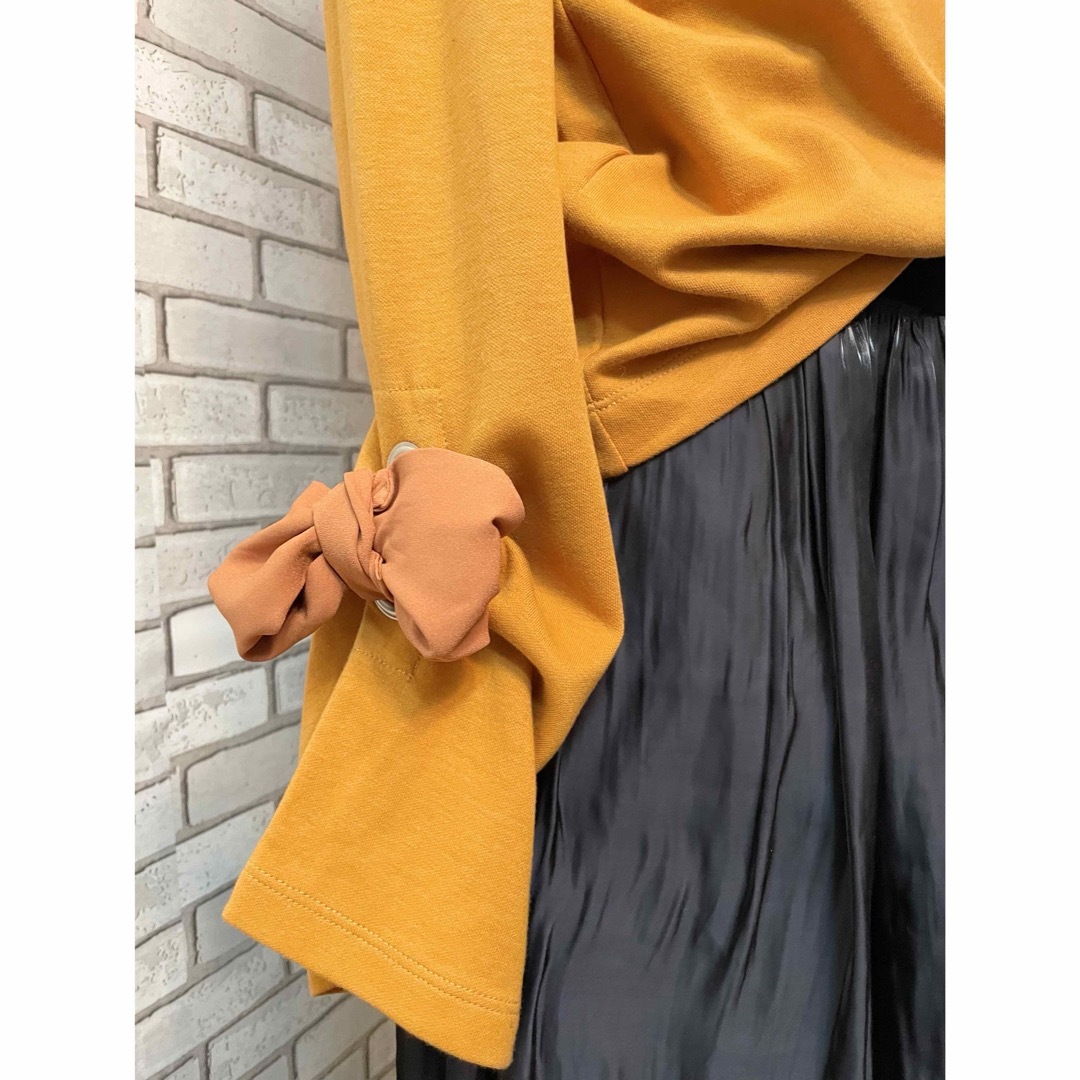 INDEX(インデックス)のindex  袖　リボン　カットソー　オレンジ色　きれいな色　長袖 レディースのトップス(カットソー(長袖/七分))の商品写真