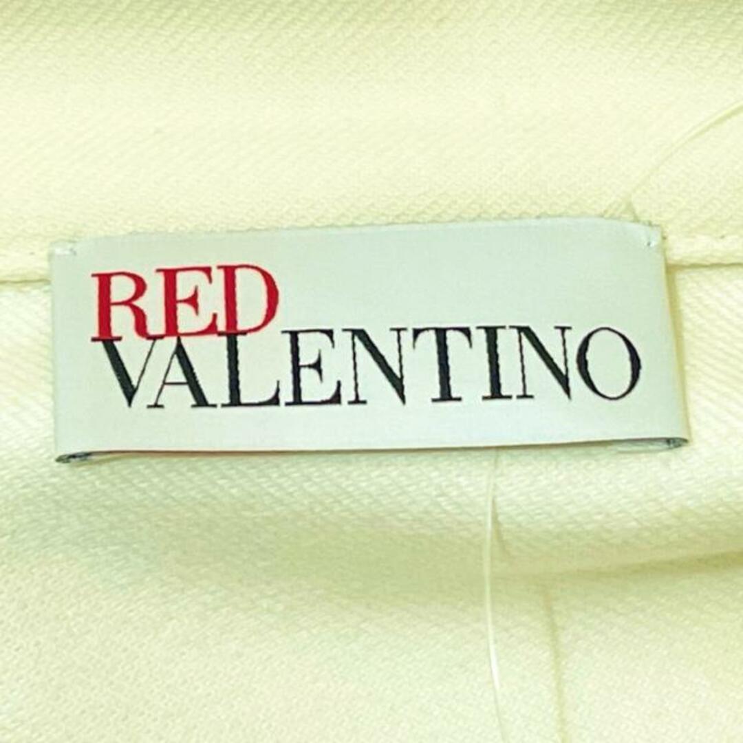 RED VALENTINO(レッドヴァレンティノ)のRED VALENTINO(レッドバレンチノ) コート サイズ40 M レディース - アイボリー 長袖/春/秋 レディースのジャケット/アウター(その他)の商品写真