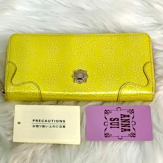 アナスイ(ANNA SUI)のANNA SUI アナスイ ロゴレザー長財布 ラウンド型押しウォレット イエロー(財布)