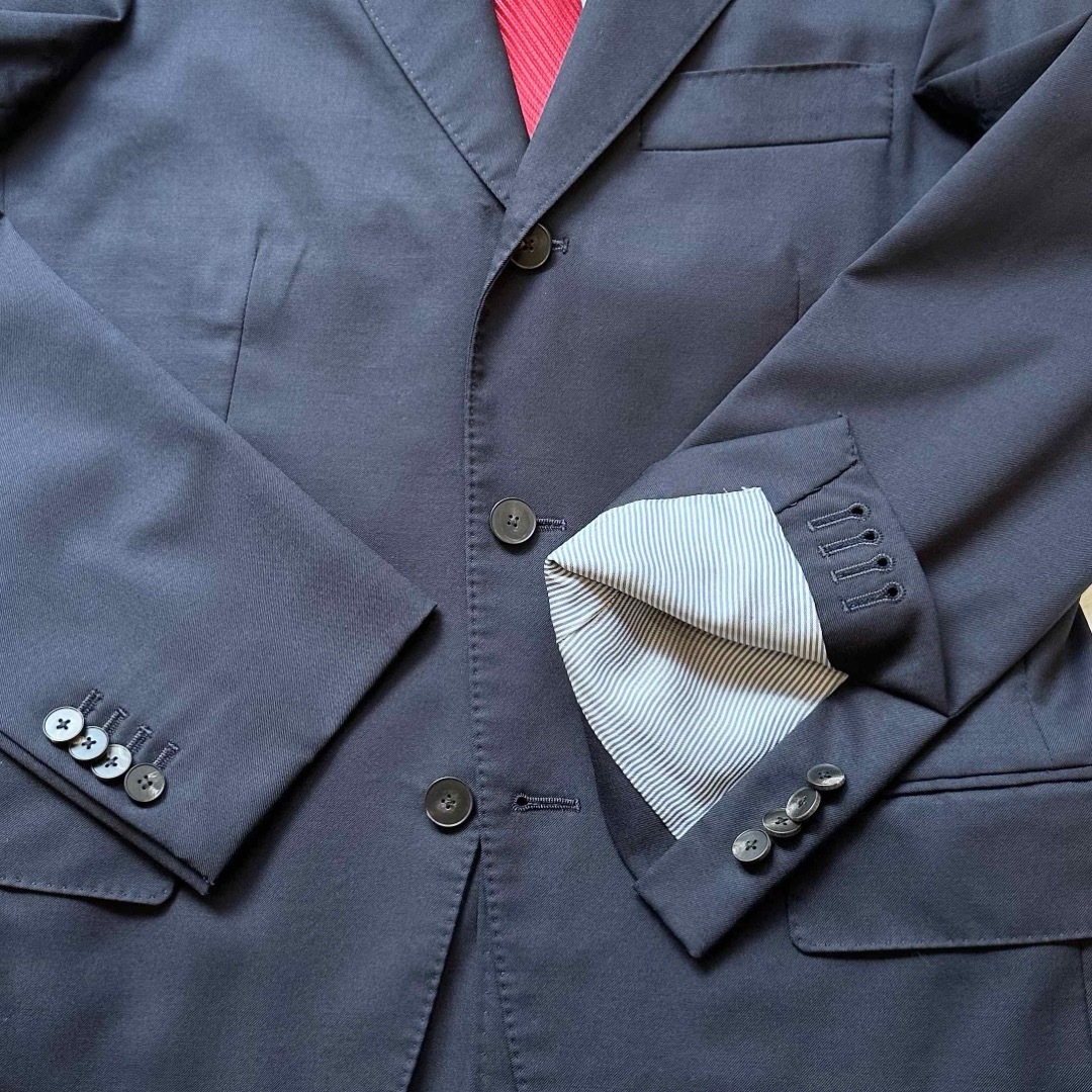 THE SUIT COMPANY(スーツカンパニー)のユニバーサルランゲージ 3Bセットアップスーツ ビジネススーツ ネイビー 背抜き メンズのスーツ(セットアップ)の商品写真