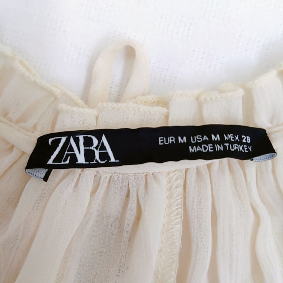 ZARA(ザラ)の《ZARA》ザラ　半袖ブラウス　リボン　フリルトップス　チュニック　ベージュ レディースのトップス(シャツ/ブラウス(半袖/袖なし))の商品写真