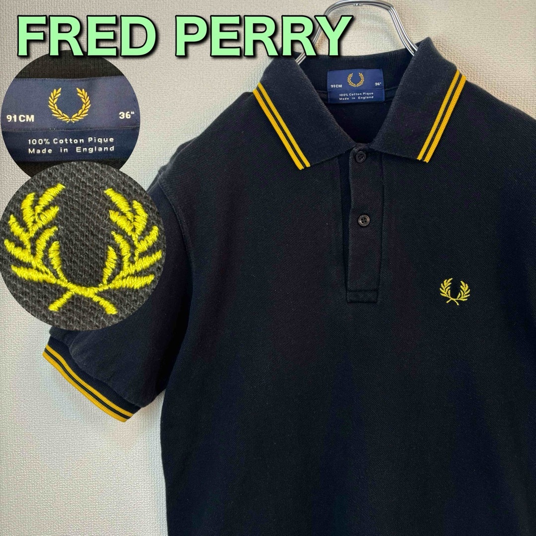FRED PERRY(フレッドペリー)の人気　フレッドペリー　ポロシャツ　英国製　黒　黄色　36 S 古着　ブラック メンズのトップス(ポロシャツ)の商品写真