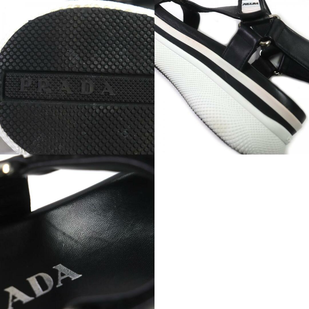 PRADA(プラダ)の美品 PRADA プラダ レザー ストラップ ロゴ入り 厚底 サンダル ブラック ホワイト シルバー金具 37.5 箱付き レディース レディースの靴/シューズ(サンダル)の商品写真