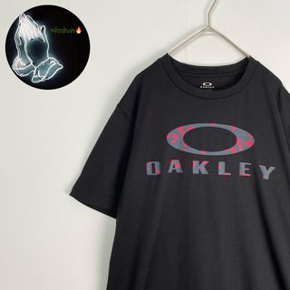 オークリー(Oakley)の【オークリー　半袖Tシャツ　センターロゴ　ダークカラー　黒　古着】(Tシャツ/カットソー(半袖/袖なし))