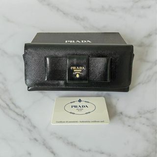 プラダ(PRADA)のPRADAプラダ 長財布 サフィアーノ フィオッコリボン　レザー ブラック(財布)