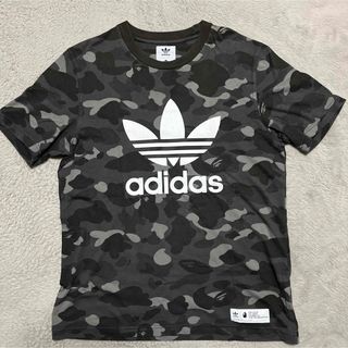 アベイシングエイプ(A BATHING APE)のAPE BAPE KAWS adidas CAMO 迷彩　tシャツ　XO 2XL(Tシャツ/カットソー(半袖/袖なし))