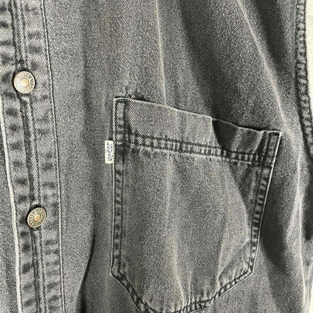 Levi's(リーバイス)の[古着]リーバイス　ベスト　フェード　刻印　白タブ　ダブルポケット　アメカジ　黒 メンズのトップス(ベスト)の商品写真