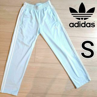 オリジナルス(Originals（adidas）)のアディダス 薄青 ファイヤーバード トラックパンツ 男性S ジャージ 裾ジップ(その他)