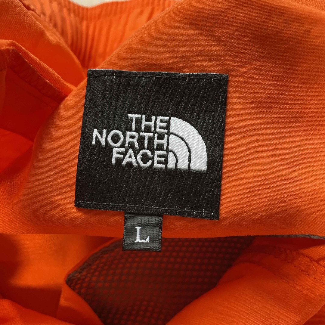 THE NORTH FACE(ザノースフェイス)のTHE NORTH FACE  ノースフェイス　半ズボン　オレンジ　未使用 メンズのパンツ(ショートパンツ)の商品写真