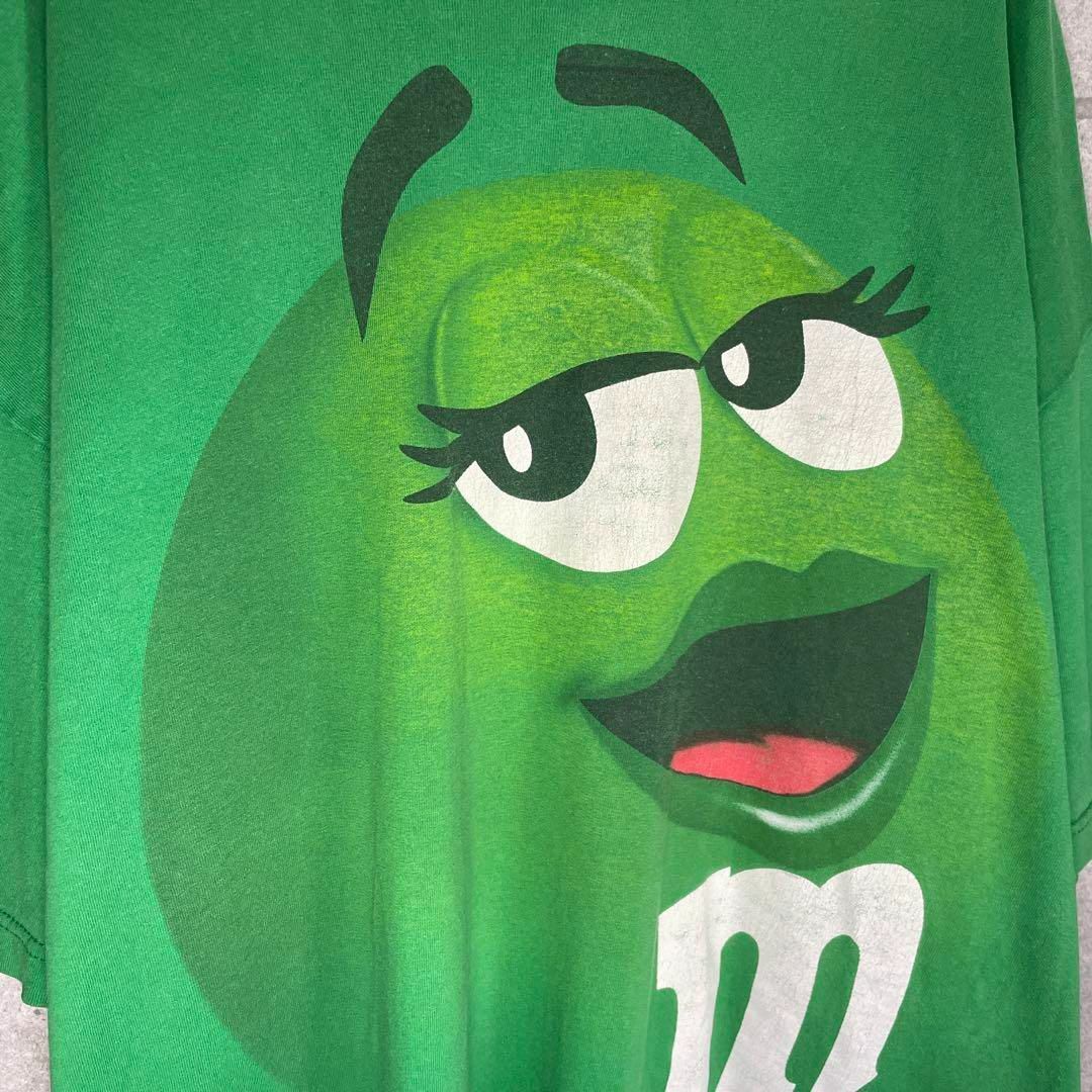 m&m&m's(エムアンドエムアンドエムズ)の[古着]M&M's　半袖　Tシャツ　チョコレート　キャラ　プリント　グリーン メンズのトップス(Tシャツ/カットソー(半袖/袖なし))の商品写真