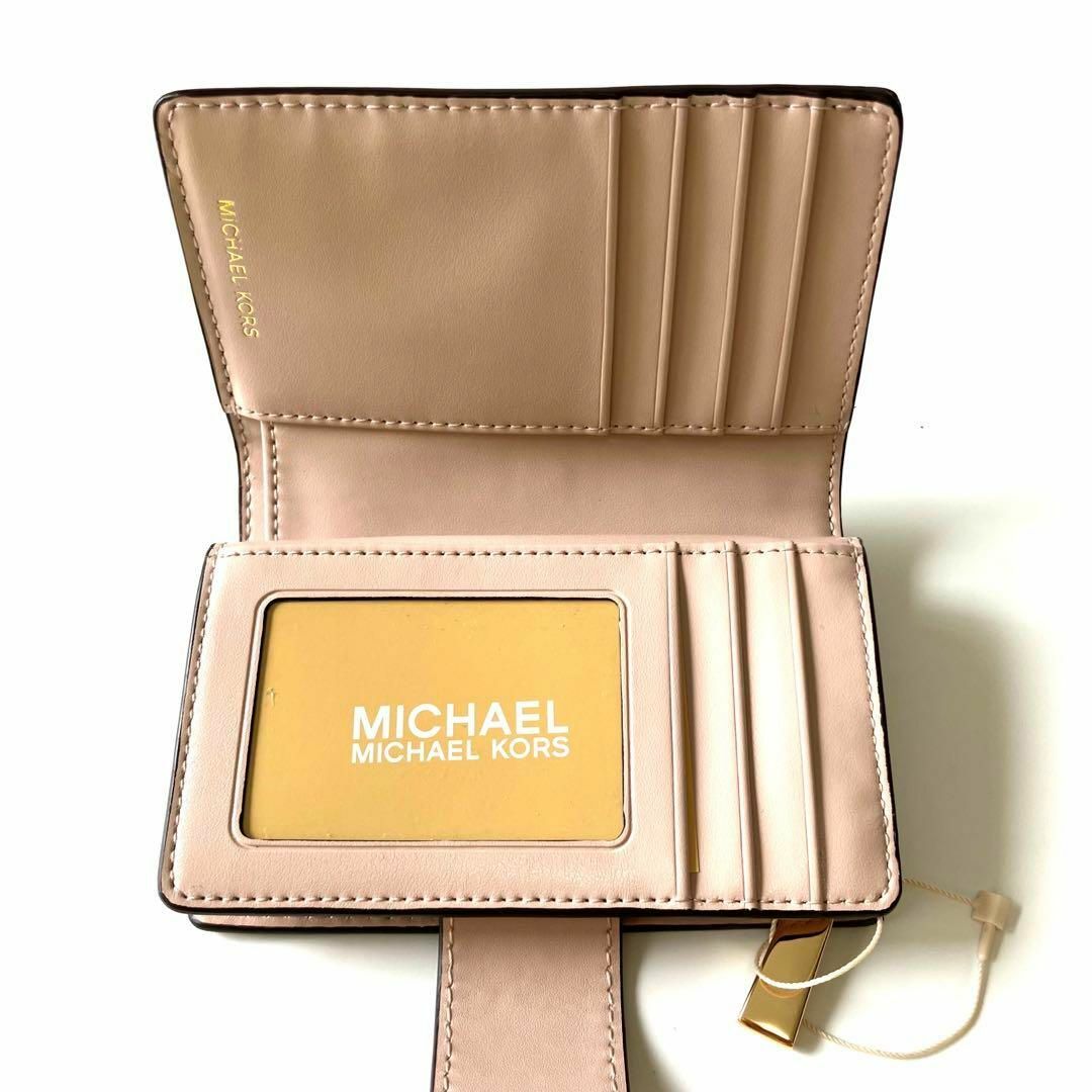 Michael Kors(マイケルコース)のマイケルコース タブ ウォレット ミディアム  MKシグネチャー  二つ折 人気 レディースのファッション小物(財布)の商品写真