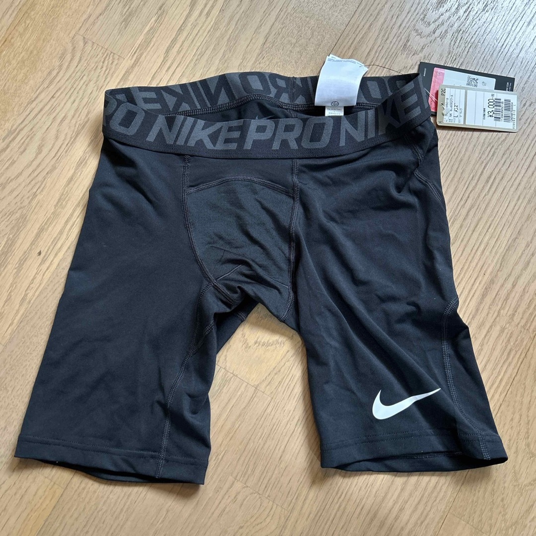 NIKE(ナイキ)の【新品】NIKEスパッツ【sizeL】 スポーツ/アウトドアのトレーニング/エクササイズ(トレーニング用品)の商品写真