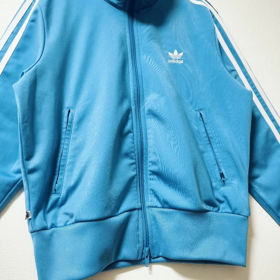 Originals（adidas）(オリジナルス)のadidas 青 ファイヤーバード 襟高 トラックトップ ジャージ 女性XOT レディースのトップス(その他)の商品写真