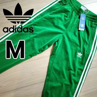 オリジナルス(Originals（adidas）)の新品 アディダス 緑 ファイヤーバード 男性M トラックパンツ ジャージ 人気(その他)