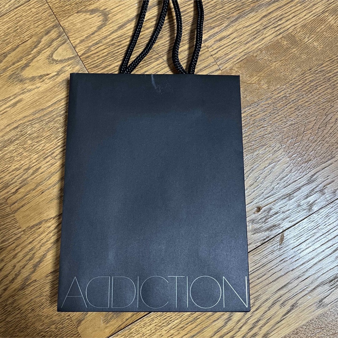 ADDICTION(アディクション)のaddiction ショッパー　紙袋 レディースのバッグ(ショップ袋)の商品写真