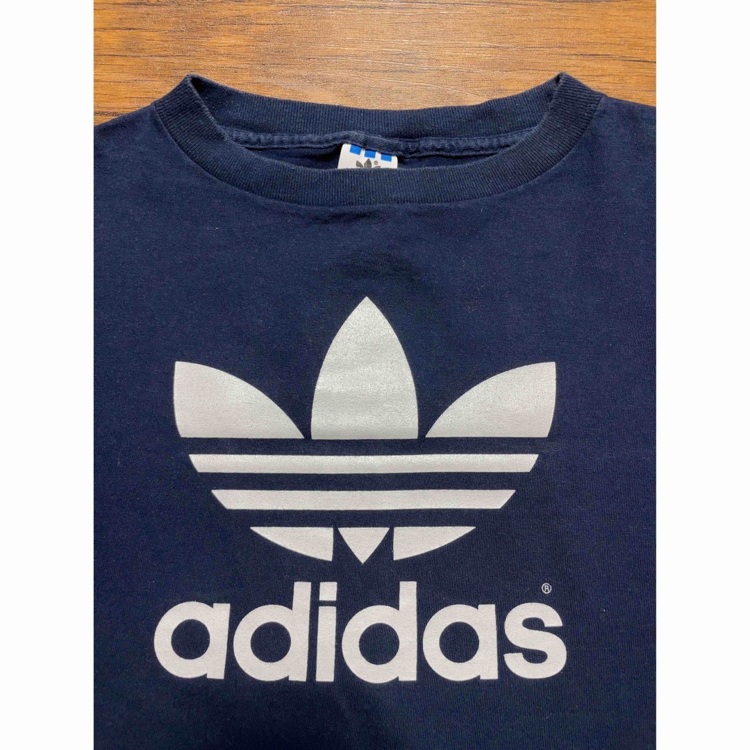 adidas(アディダス)の80s『adidas』アディダス Tシャツ 万国旗タグ　トレフォイル　USA製 メンズのトップス(Tシャツ/カットソー(半袖/袖なし))の商品写真