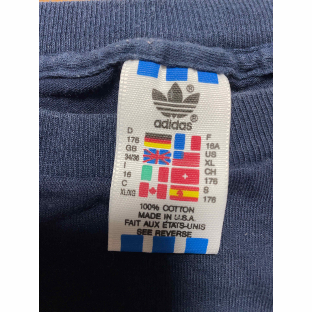 adidas(アディダス)の80s『adidas』アディダス Tシャツ 万国旗タグ　トレフォイル　USA製 メンズのトップス(Tシャツ/カットソー(半袖/袖なし))の商品写真