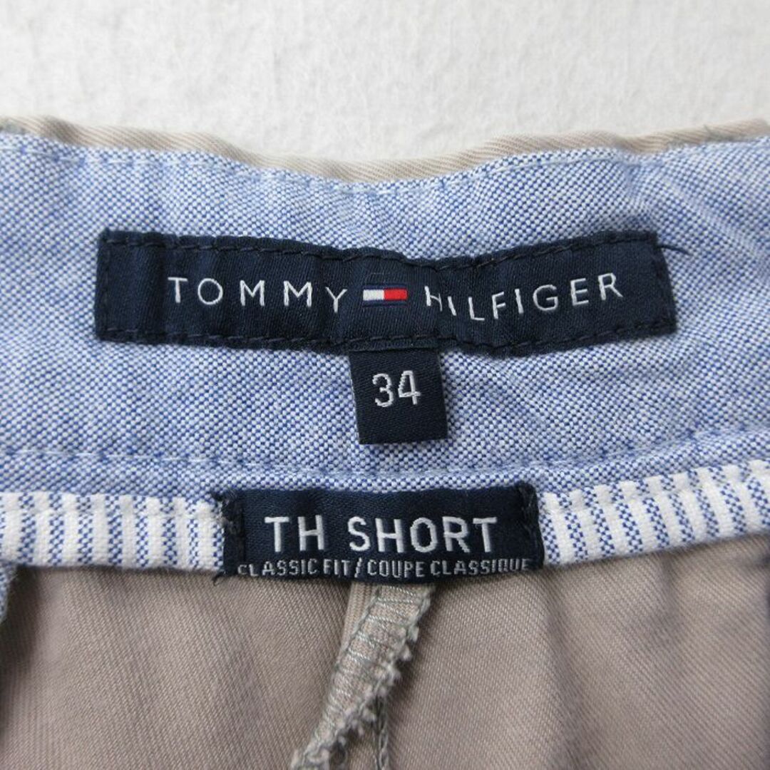 TOMMY HILFIGER(トミーヒルフィガー)のW34★古着 トミーヒルフィガー TOMMY HILFIGER ブランド ショート パンツ ショーツ メンズ ワンポイントロゴ コットン 薄ベージュ カーキ 23jun08 中古 ボトムス 短パン ショーパン ハーフ メンズのパンツ(ワークパンツ/カーゴパンツ)の商品写真