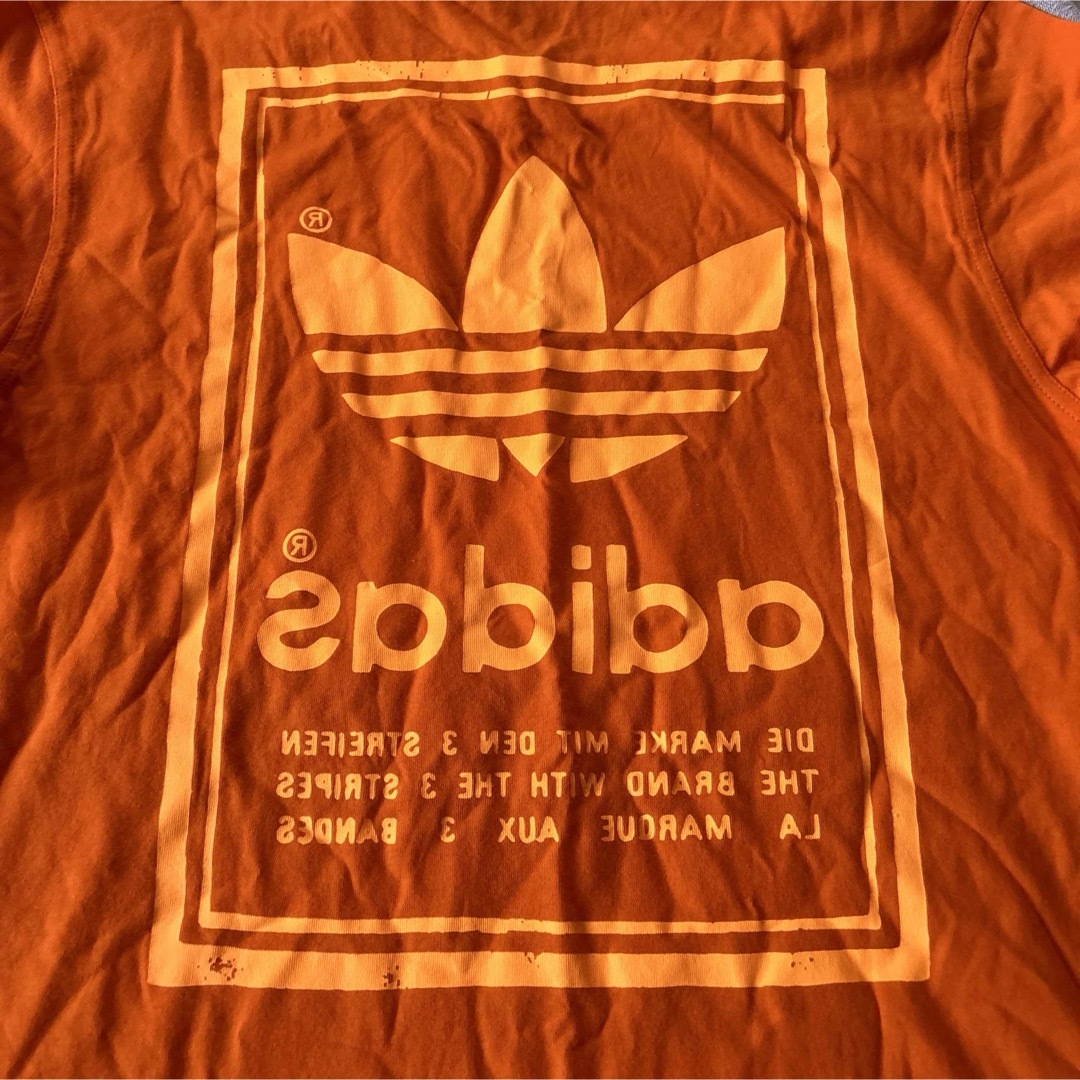 adidas(アディダス)の新品　アディダス　adidas Tシャツ　サイズO オレンジ メンズのトップス(Tシャツ/カットソー(半袖/袖なし))の商品写真