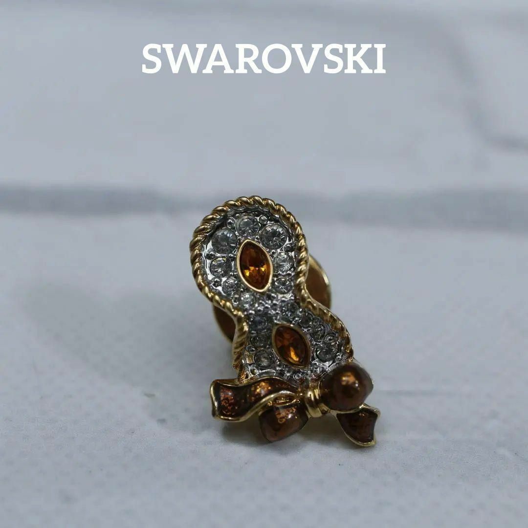 SWAROVSKI(スワロフスキー)の【匿名配送】 SWAROVSKI スワロフスキー ブローチ ゴールド リボン レディースのアクセサリー(ブローチ/コサージュ)の商品写真