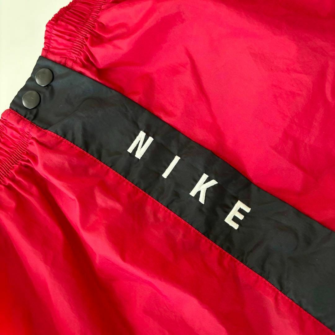 NIKE(ナイキ)のNIKE ナイキ 古着 ナイロンパンツ スナップパンツ サイドライン M メンズのパンツ(その他)の商品写真