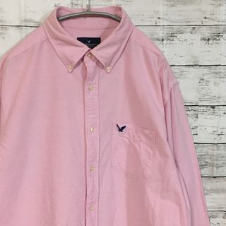 アメリカンイーグル(American Eagle)の【希少】アメリカンイーグル AE ピンク M ロゴ 長袖シャツ 古着(シャツ)