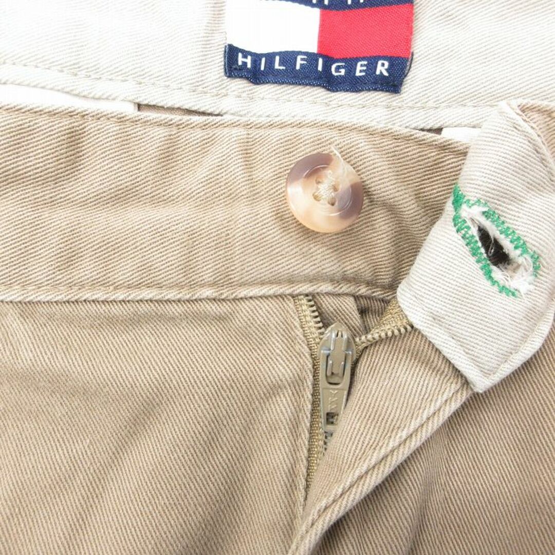 TOMMY HILFIGER(トミーヒルフィガー)のW31★古着 トミーヒルフィガー TOMMY HILFIGER ブランド チノ パンツ チノパン メンズ 90年代 90s ワンポイントロゴ コットン ベージュ カーキ 23dec08 中古 ボトムス ロング メンズのパンツ(ワークパンツ/カーゴパンツ)の商品写真