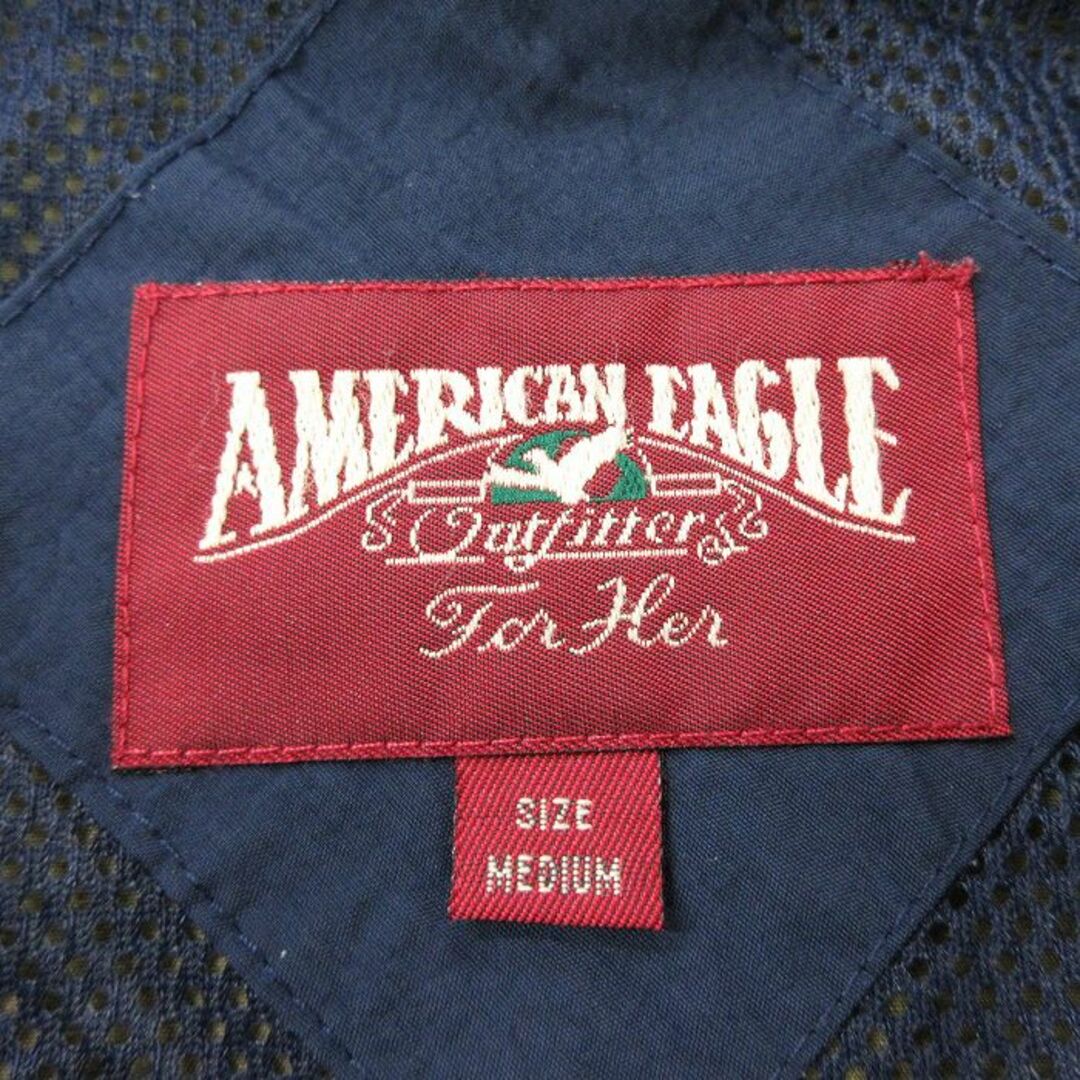 American Eagle(アメリカンイーグル)の古着 アメリカンイーグル American Eagle 長袖 ナイロン ジャケット レディース 00年代 00s ワンポイントロゴ ラグラン 大きいサイズ 濃緑 グリーン 23dec14 中古 アウター ウインドブレーカー レディースのジャケット/アウター(ロングコート)の商品写真