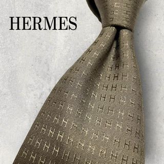 エルメス(Hermes)の美品 HERMES エルメス H柄 ファソネ 総ロゴ ネクタイ ブラウン 茶(ネクタイ)