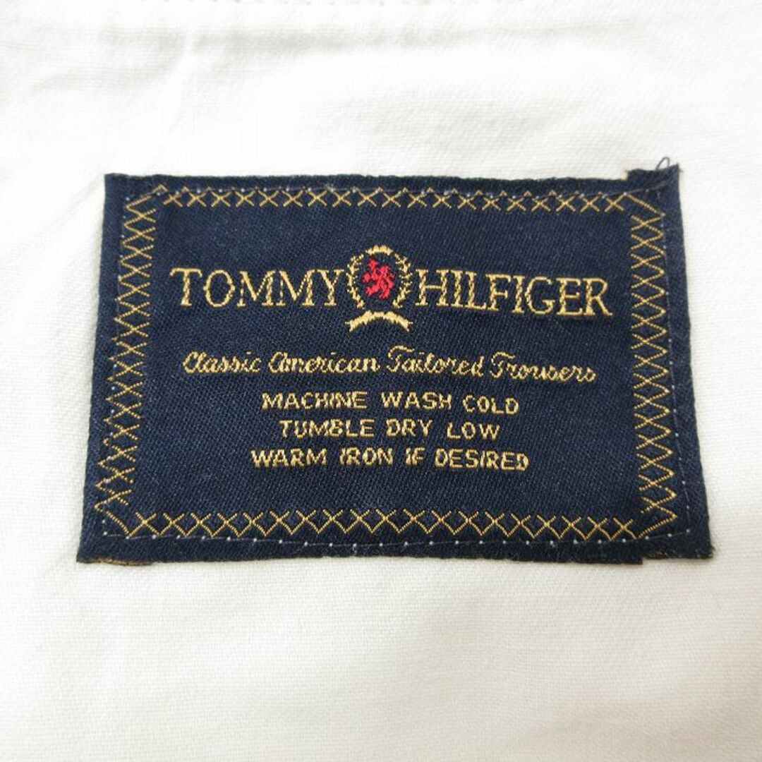 TOMMY HILFIGER(トミーヒルフィガー)のW35★古着 トミーヒルフィガー TOMMY HILFIGER ブランド チノ パンツ チノパン メンズ 80年代 80s ワンポイントロゴ タロン ベージュ カーキ 24feb14 中古 ボトムス ロング メンズのパンツ(ワークパンツ/カーゴパンツ)の商品写真