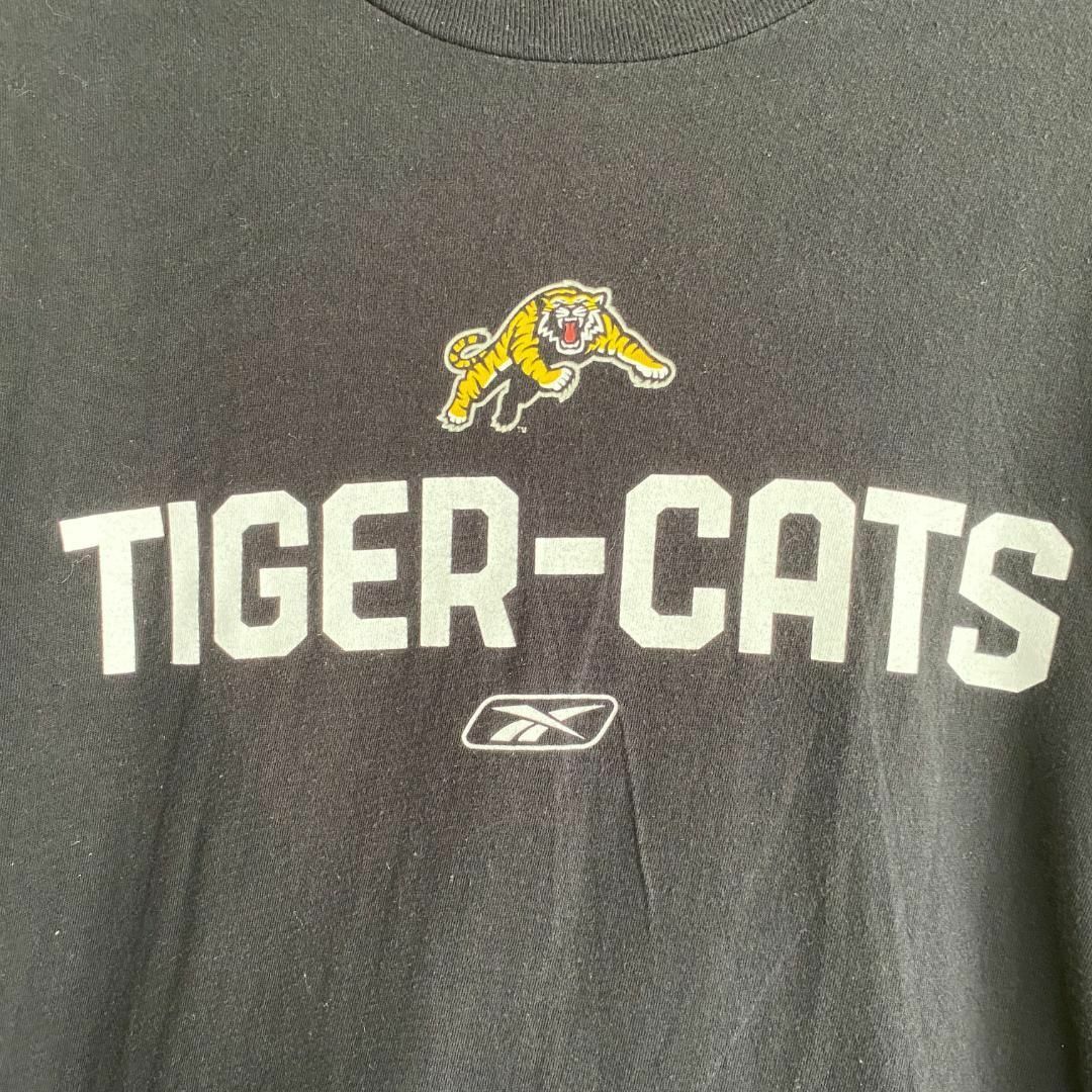 Reebok(リーボック)のアメリカ古着　CFL　ハミルトン・タイガーキャッツ　長袖　Tシャツ　ロンT メンズのトップス(Tシャツ/カットソー(七分/長袖))の商品写真