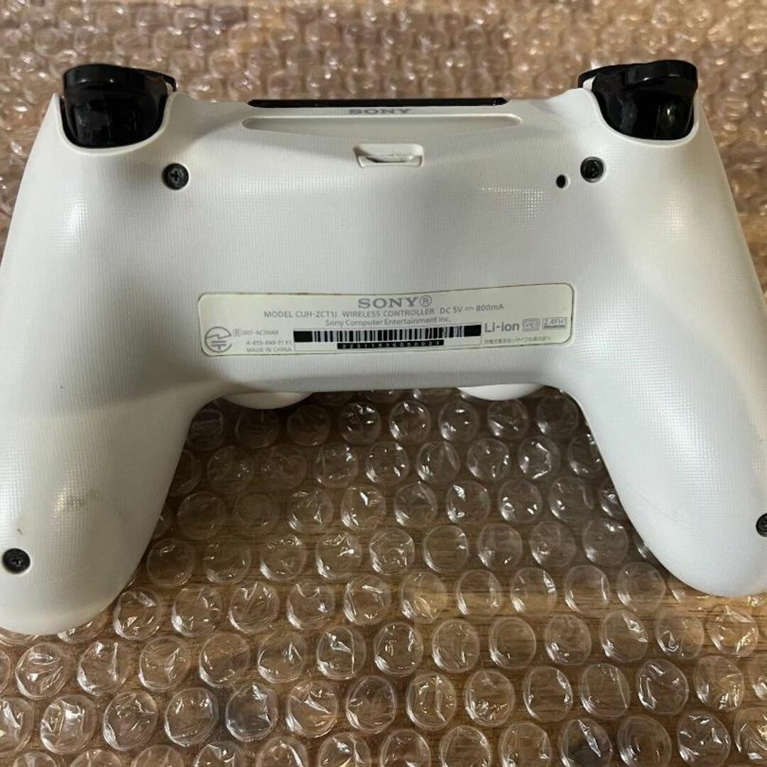 SONY(ソニー)の【ジャンク】コントローラー(DUALSHOCK 4)ホワイト CUH-ZCT1J エンタメ/ホビーのゲームソフト/ゲーム機本体(その他)の商品写真