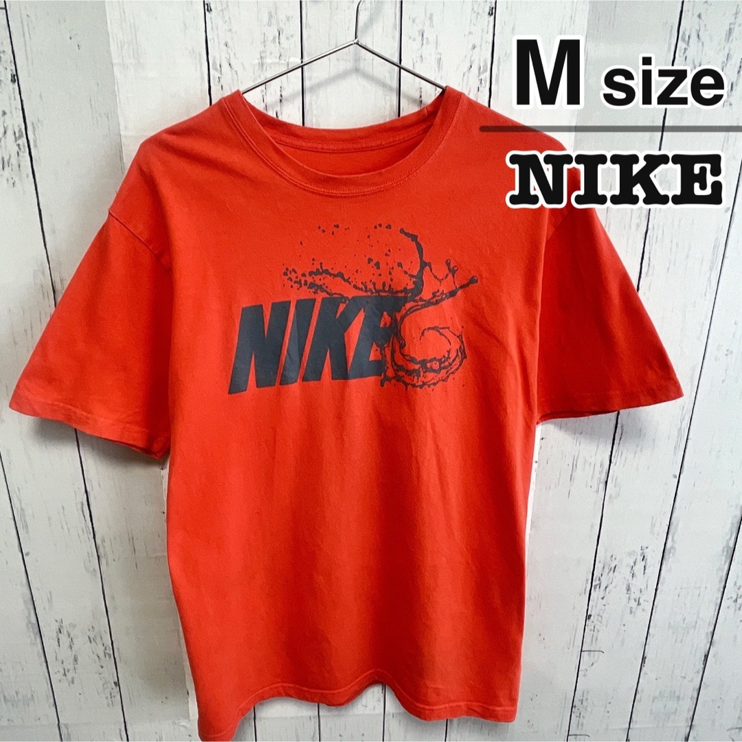 NIKE(ナイキ)のNIKE　Tシャツ　Mサイズ　オレンジ　プリント　ロゴ　コットン　USA古着 メンズのトップス(Tシャツ/カットソー(半袖/袖なし))の商品写真