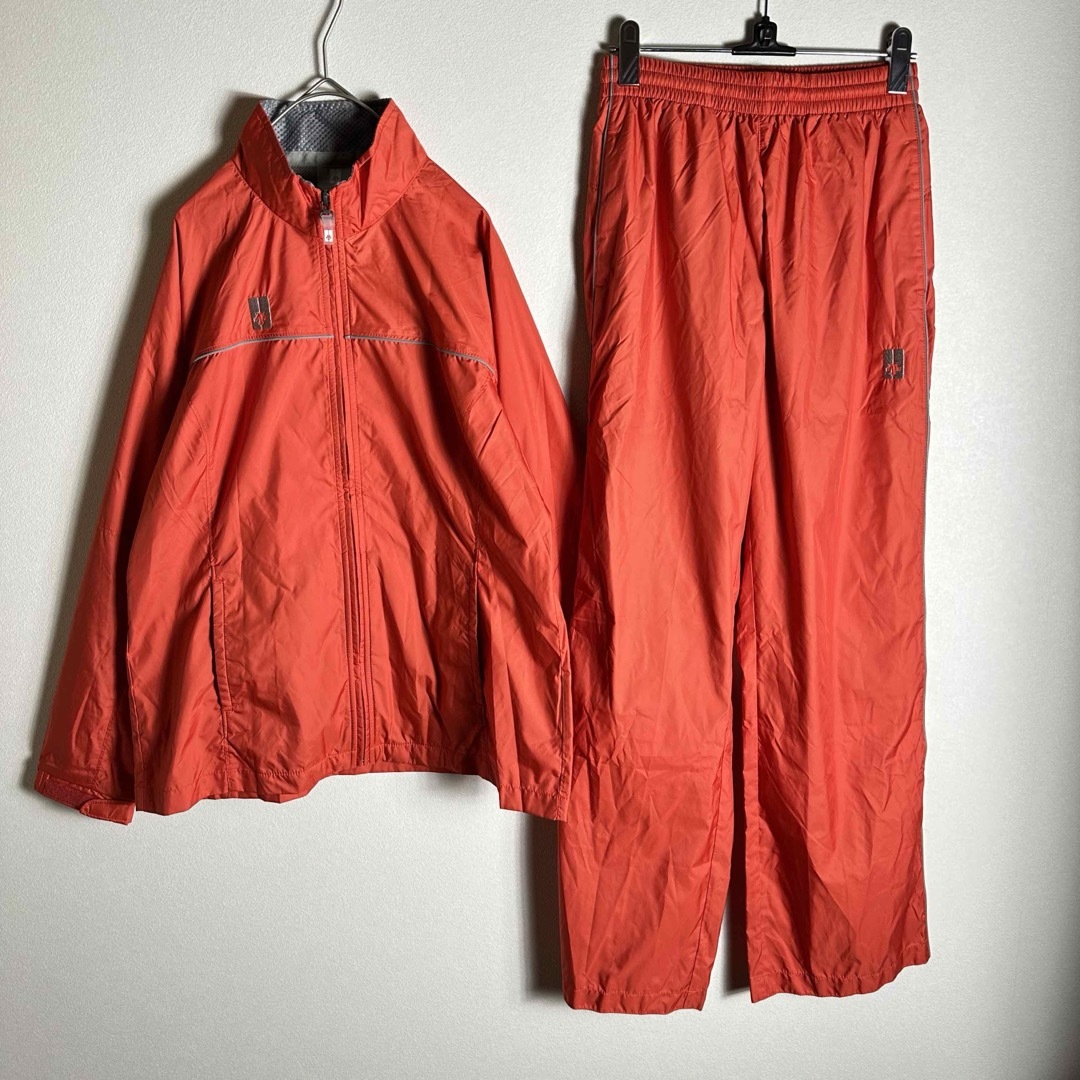 DESCENTE(デサント)のパンツ新品タグ付き　デサント　トラックジャケット上下　Mサイズ　オレンジ　古着 メンズのジャケット/アウター(ナイロンジャケット)の商品写真