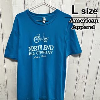 アメリカンアパレル(American Apparel)のUSA製　American Apparel　Tシャツ　L　水色　プリント　古着(Tシャツ/カットソー(半袖/袖なし))