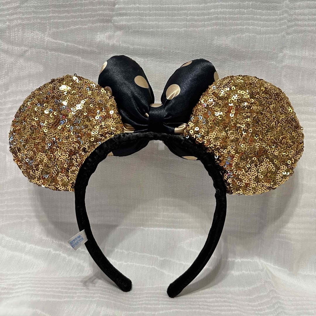 Disney(ディズニー)のディズニー　ミニーカチューシャ　スパンコール　ゴールド　ブラック　美品 レディースのヘアアクセサリー(カチューシャ)の商品写真