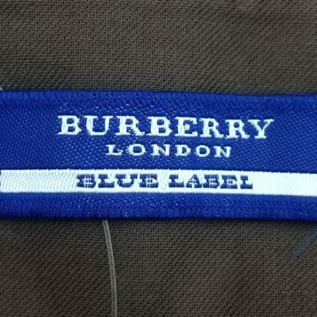 BURBERRY BLUE LABEL(バーバリーブルーレーベル)のBurberry Blue Label(バーバリーブルーレーベル) 巻きスカート サイズ36 S レディース美品  - ダークブラウン×ライトブルー×ベージュ ミニ/ボーダー レディースのスカート(その他)の商品写真