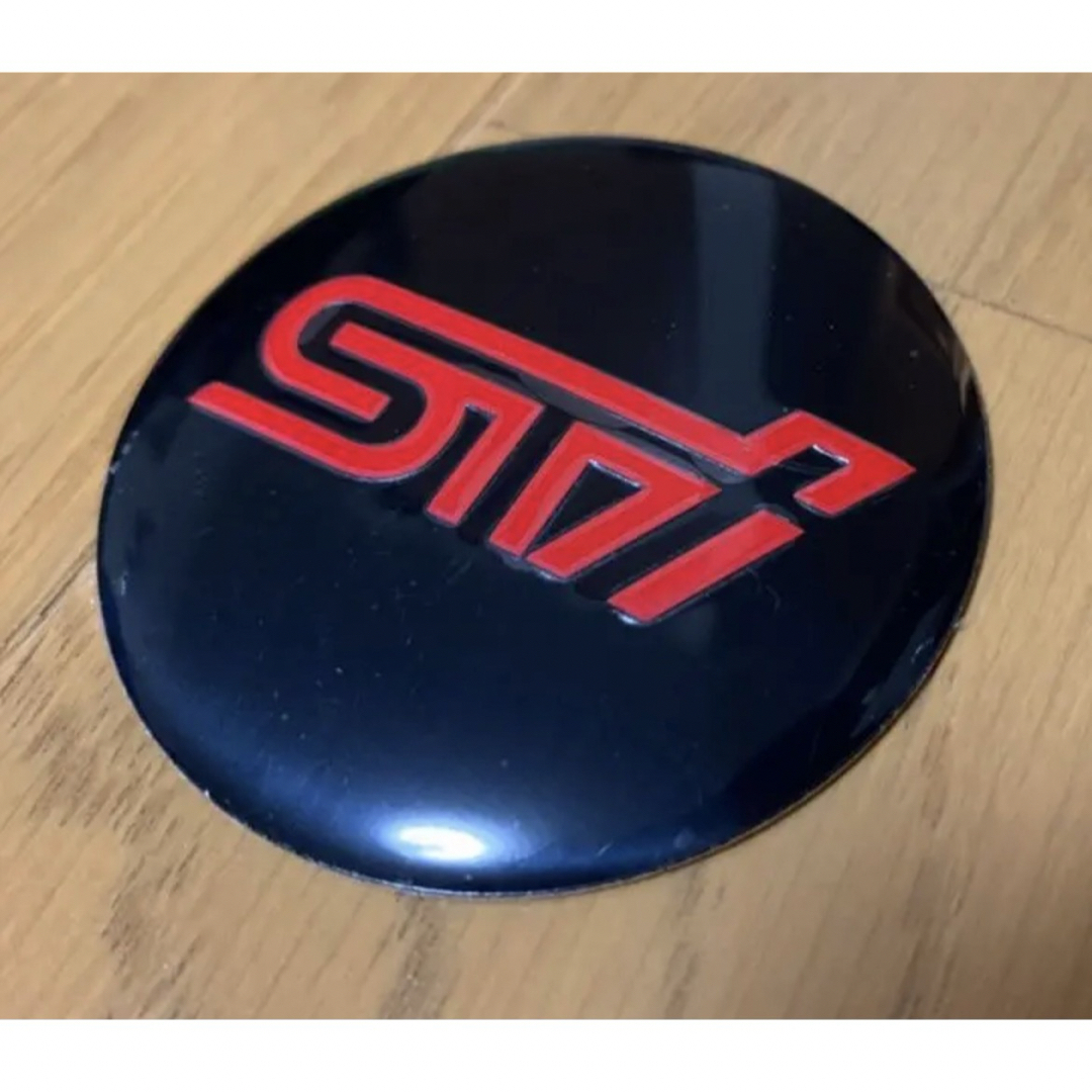 スバル(スバル)のSTI ホイールセンターキャップ 自動車/バイクの自動車(車外アクセサリ)の商品写真