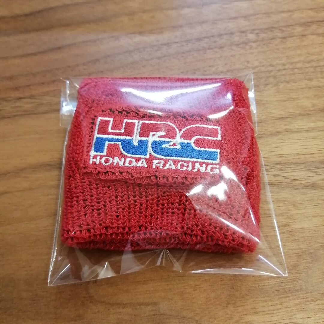 ホンダ(ホンダ)のHONDA HRC  RACING 赤 マスターシリンダーカバー 自動車/バイクのバイク(パーツ)の商品写真