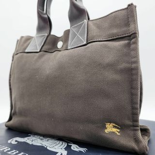 バーバリーブルーレーベル(BURBERRY BLUE LABEL)のバーバリーブルーレーベル ミニトート キャンバス ホースロゴ 銀ボタン カーキ(トートバッグ)