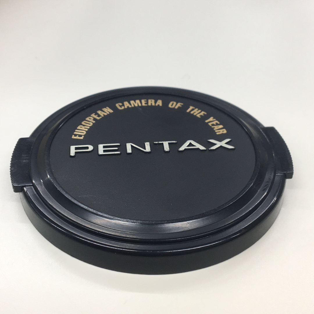 PENTAX(ペンタックス)のPENTAX 純正レンズキャップ ビンテージ カメラオブイヤー受賞記念 Φ58 スマホ/家電/カメラのカメラ(レンズ(単焦点))の商品写真