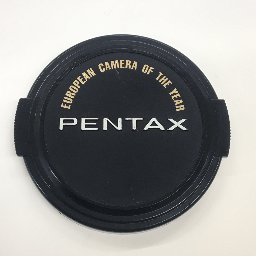 PENTAX(ペンタックス)のPENTAX 純正レンズキャップ ビンテージ カメラオブイヤー受賞記念 Φ58 スマホ/家電/カメラのカメラ(レンズ(単焦点))の商品写真