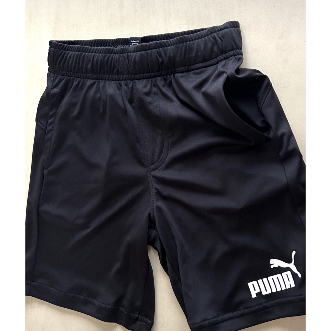 PUMA(プーマ)の新品タグ付き　120㎝ PUMAプーマ上下セットアップ　オレンジ×ブラック キッズ/ベビー/マタニティのキッズ服男の子用(90cm~)(Tシャツ/カットソー)の商品写真