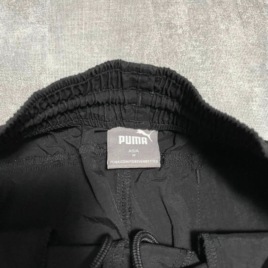 PUMA(プーマ)のナイロンジャージ下 ジョガーパンツ プーマ プリントロゴ M ブラック メンズのパンツ(その他)の商品写真