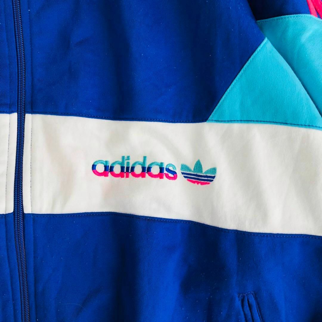 adidas(アディダス)のAdidasアディダストラックジャケット青水色白ピンク万国旗タグ古着Sジャージ メンズのトップス(ジャージ)の商品写真