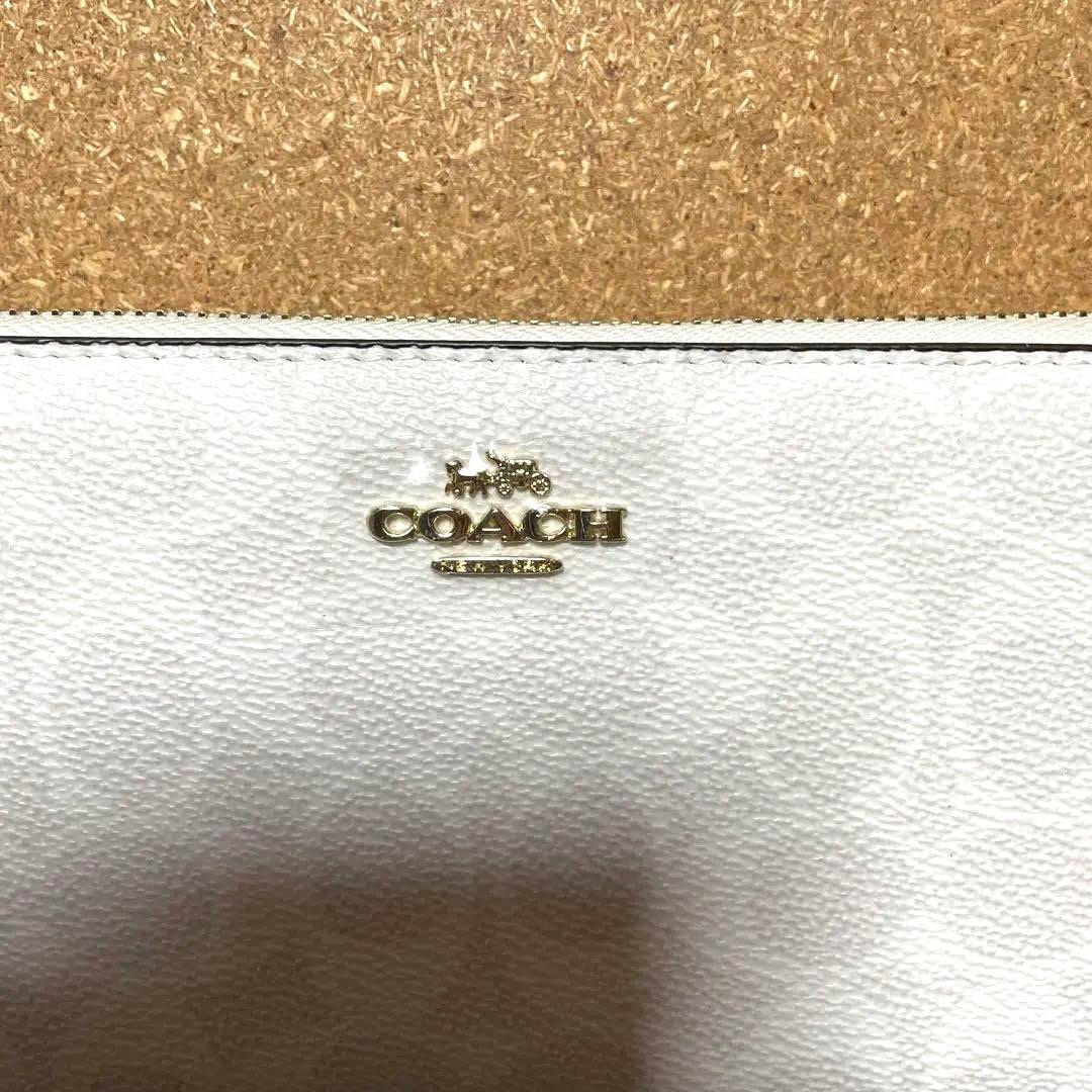 COACH(コーチ)のCOACH コーチ　ストラップ付き　長財布　シグネチャー チョーク　ホワイト レディースのファッション小物(財布)の商品写真