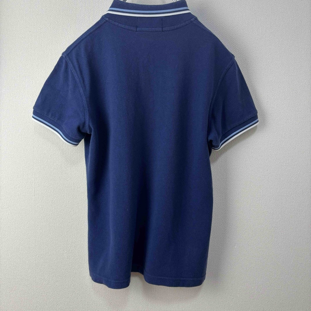 FRED PERRY(フレッドペリー)の人気　フレッドペリー　レディース　ポロシャツ　英国製　青白　12 L 古着 レディースのトップス(ポロシャツ)の商品写真