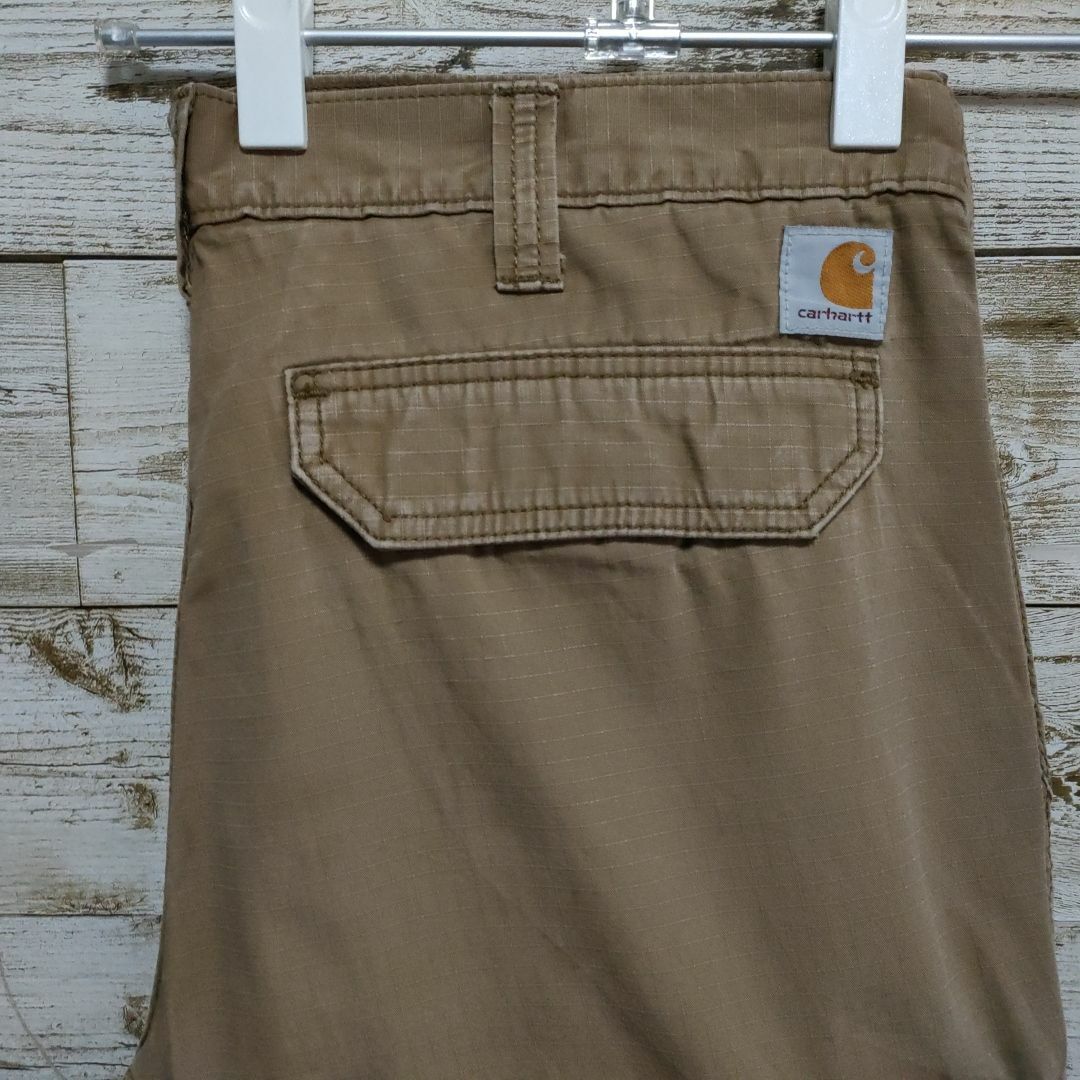 carhartt(カーハート)の【116】USA規格カーハートダック地ワーク系パンツロゴ付き メンズのパンツ(ワークパンツ/カーゴパンツ)の商品写真